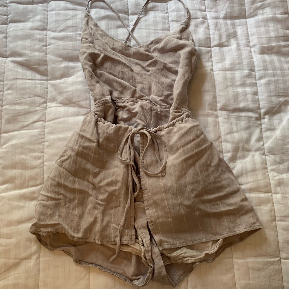 Lavender, romper with ties in the back.